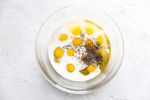 1 dozen eggs, salt, pepper and milk in a large mixing bowl