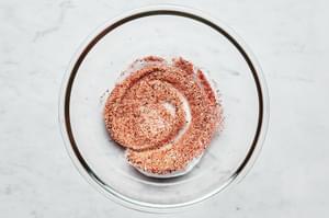 salt, pepper, garlic powder, paprika and cayenne mixed together in a small glass bowl
