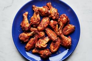 Homemade baked chicken wings on a plate seasoned with salt, pepper, garlic powder, paprika and cayenne