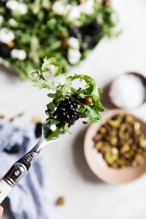 a bite of Blackberry chèvre Salad With Honey Mustard Dressing on a fork