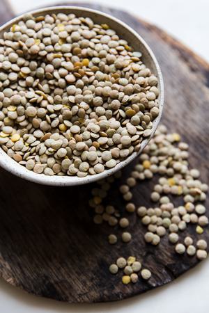 Dried brown lentils in bowl