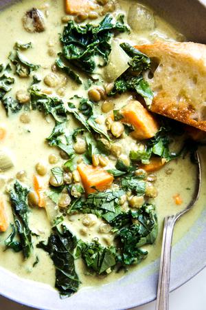 close up of coconut curry lentil soup with toasted bread