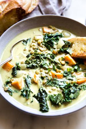 side shot of coconut curry lentil soup in bowl