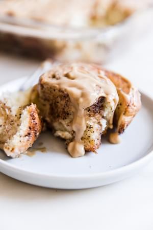 Coffee Cinnamon Rolls With Maple Cream Cheese Icing on a plate
