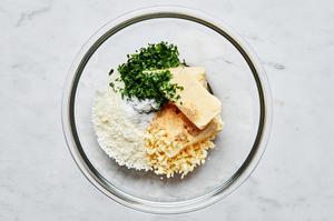 butter, parsley, garlic, garlic powder, salt and parmesan in a bowl to make a spread for french bread pizza