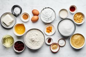 flour, cinnamon, cloves, ginger, eggs, applesauce, vanilla, orange zest & juice, cream cheese, powdered sugar in prep bowls