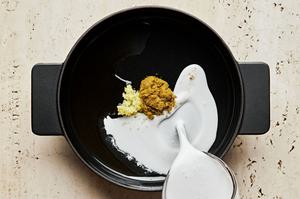 coconut milk, curry paste, lime juice, ginger, and fish sauce in a large pot to make green curry salmon