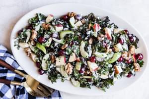 Grilled Chicken Waldorf Salad With Kale, grapes, walnuts and celery on a plater