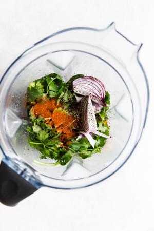 cilantro, onion, paprika, lime, olive oil in a blender for jerk marinade