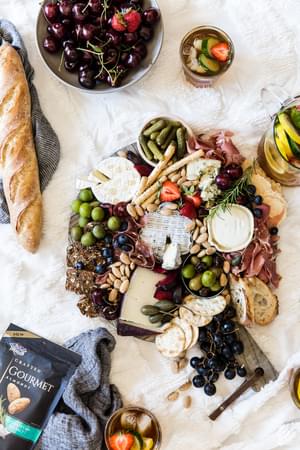 a cheese board at a picnic
