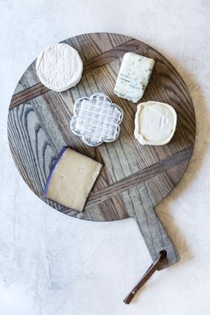 5 cheese varieties on a charcuterie board