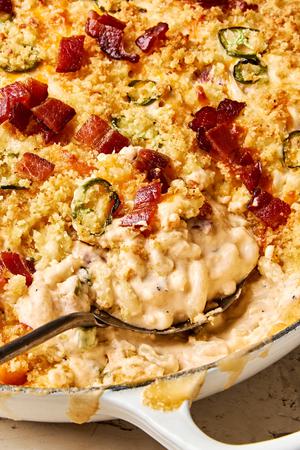 jalapeño popper mac and cheese made with cream cheese, cheddar, pepper jack, bacon and jalapeños, topped with panko