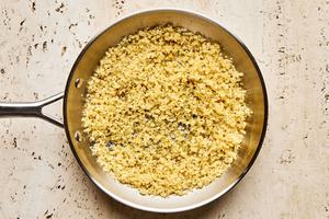 panko being browned in butter in a skillet