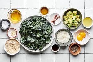 romaine lettuce, avocado, parmesan, egg yolks, anchovies, olive oil, garlic, salt, pepper and worcestershire in bowls