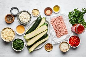 zucchini, ground chicken, bell pepper, spices, marinara, ricotta, spinach, egg, parsley, mozzarella and Parm in prep bowls