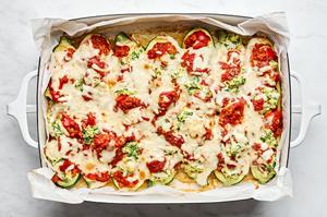 lasagna stuffed zucchini boats made with ground chicken, marinara, ricotta, mozzarella and Parmesan