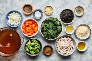 turkey, stock, wild rice, onion, carrots, celery, garlic, spices, kale and Parmesan in prep bowls