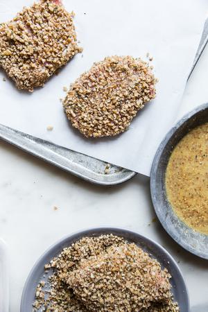 pecan crusted pork chops on parchment paper