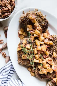 Pecan Crusted Pork Chops With Apple Chutney  on a plate