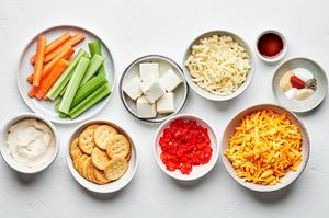 cheddar, cream cheese, mayo, spices, worcestershire, diced pimento, ritz crackers, celery and carrots to make pimento cheese