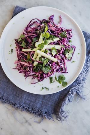Red Cabbage And Green Apple Slaw with cilantro on a plate