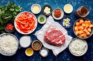 chuck roast, sweet potatoes, onion, red bell peppers, coconut milk, lemon grass, lime juice and ginger in prep bowls