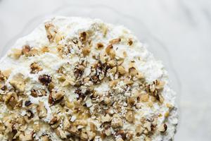 banana walnut cake on a cake stand