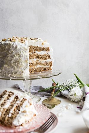 banana walnut cake on a cake stand
