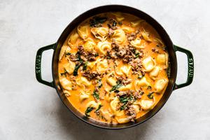 a large pot of homemade tortellini soup with Italian sausage and kale