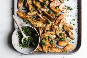 Crispy Roasted Potatoes With Gremolata on a baking sheet