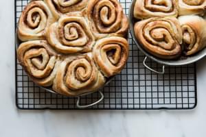 vegan cinnamon rolls fresh out of the oven ready to be frosted