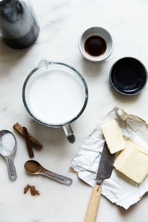 ingredients for iced bulletproof coffee, coconut milk, MCT oil, coffee, vanilla, cinnamon