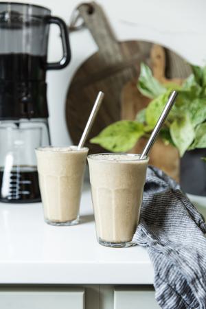 iced bullet proof coffee in glass with cinnamon