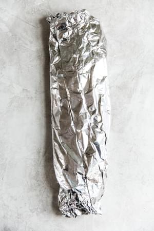 a fillet of salmon wrapped in foil