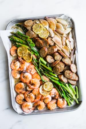 Shrimp And Sausage Sheet Pan Dinner with asparagus and lemon