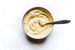 curry aioli in a small bowl with a spoon