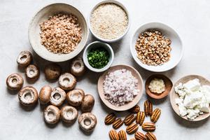 ingredients laid out for stuffed mushrooms panko, pecans, goat cheese, shallots