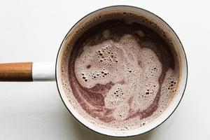homemade hot chocolate in a white sauce pan