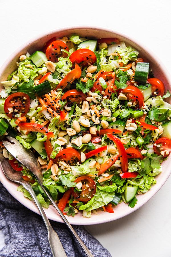 Asian Chopped Salad in a large bowl with serving spoons