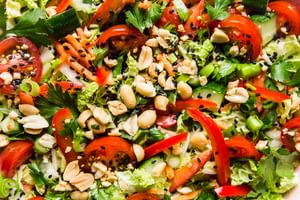 Asian Chopped salad topped with fresh cilantro, green onions and crushed peanuts
