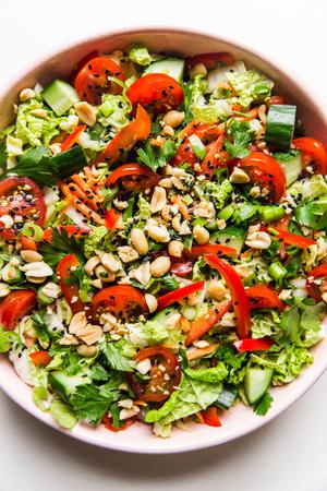 Asian Chopped salad topped with fresh cilantro, green onions and crushed peanuts