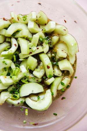 asian cucumber salad in a large glass bowl