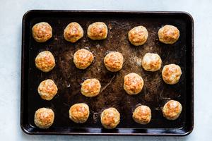 baked chicken meatballs on a baking sheet