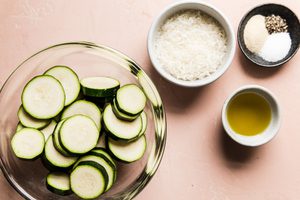 ingredients laid out to make the most irresistible roasted zucchini with parmesan