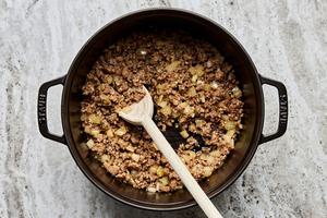 ground Italian sausage, onion, and garlic being cooked in a pot