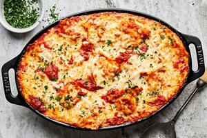 baked ravioli made with ground italian sausage, onion, garlic, marinara, spices, cream and mozzarella topped with parsley