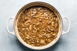 easy beef stroganoff sauce with mushrooms and onions in a skillet