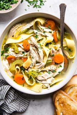 Quick Easy Chicken Noodle Soup in a bowl with a spoon