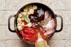 onion, garlic, tomatoes, potatoes, chicken stock, bbq sauce, Worcestershire, brown sugar, spices and chicken thighs in a pot