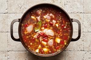 onion, garlic, tomatoes, potatoes, chicken stock, bbq sauce, Worcestershire, brown sugar, spices and chicken thighs in a pot